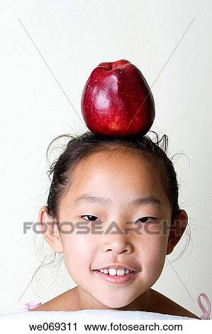 child, aiming, balance, Asian, apple, aim View Large Photo Image Stock Image - child, aiming, balance, Asian, apple, aim. Fotosearch