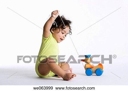 child, Arms raised, brunette, barefoot, baby, amusement View Large Photo Image Stock Photo - child, Arms raised, brunette, barefoot, baby, amusement. Fotosearch