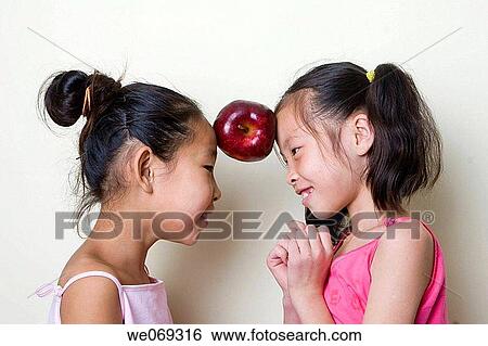 childhood, apple, child, balance, Asian, amusement View Large Photo Image Stock Photograph - childhood, apple, child, balance, Asian, amusement. Fotosearch