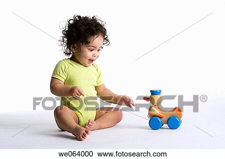 childhood, baby, child, brunette, barefoot, amusement View Large Photo Image Stock Image - childhood, baby, child, brunette, barefoot, amusement. Fotosearch