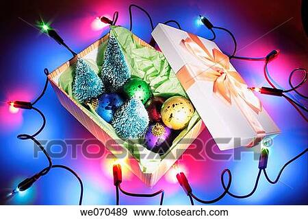Christmas Lights Around Box of Christmas Ornaments View Large Photo Image Stock Photo - Christmas Lights Around Box of Christmas Ornaments. Fotosearch