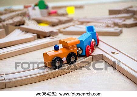 close up of a brightly coloured toy train, on a wooden track View Large Photo Image Stock Image - close up of a brightly coloured toy train, on a wooden track. Fotosearch