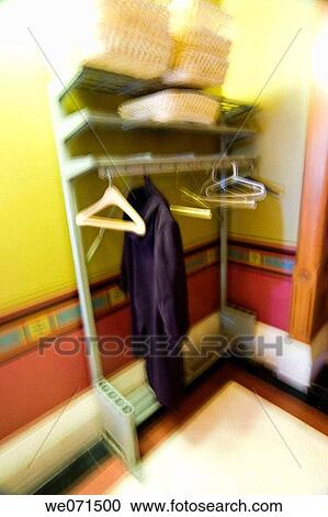 Coat hanging on a coatrack. View Large Photo Image Stock Image - Coat hanging on a coatrack.. Fotosearch