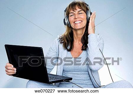 computer, contemporary, cross-legged View Large Photo Image Stock Photo - computer, contemporary, cross-legged. Fotosearch