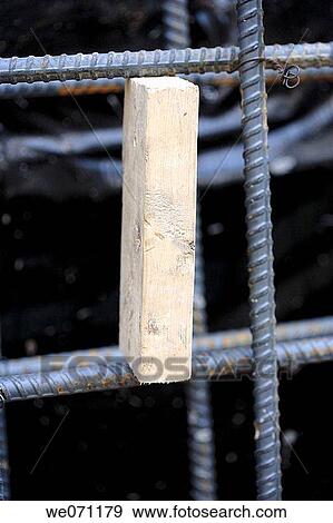 Construction steel rebar separated by 2x4 wood block View Large Photo Image Stock Photo - Construction steel rebar separated by 2x4 wood block. Fotosearch