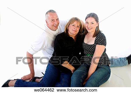 couple with their 18 year old daughter sitting on the floor in the studio smiling into camera View Large Photo Image Stock Image - couple with their 18 year old daughter sitting on the floor in the studio smiling into camera. Fotosearch