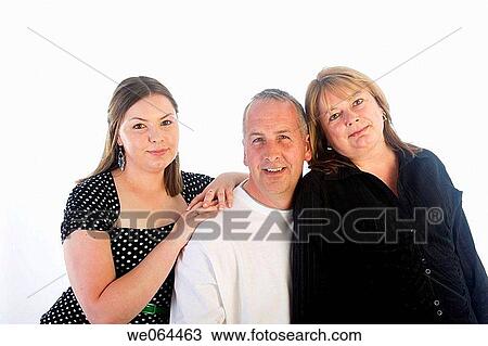 couple with their 18 year old daughter standing in the studio smiling into camera View Large Photo Image Stock Image - couple with their 18 year old daughter standing in the studio smiling into camera. Fotosearch
