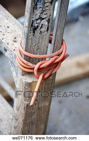 Stock Photograph - Cut electrical cable wrap around step ladder. Fotosearch