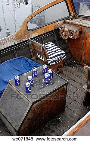 Empty beer-cans on a rotten wooden motor-boat, Sweden, Scandinavia, Europe View Large Photo Image Stock Photo - Empty beer-cans on a rotten wooden motor-boat, Sweden, Scandinavia, Europe. Fotosearch