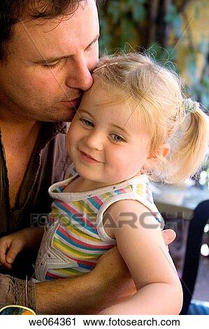 father kissing his 3 year old daughter on the cheek View Large Photo Image Stock Image - father kissing his 3 year old daughter on the cheek. Fotosearch
