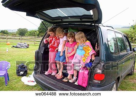 four, 4 year old girls standing in the back of the car on a camping trip View Large Photo Image Stock Photo - four, 4 year old girls standing in the back of the car on a camping trip. Fotosearch