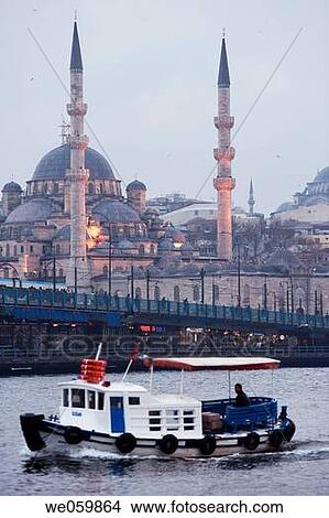 Galata bridge, Yeni mosque and ferry boat on the Bosphore at sunset, Istanbul. Turkey View Large Photo Image Picture - Galata bridge, Yeni mosque and ferry boat on the Bosphore at sunset, Istanbul. Turkey. Fotosearch