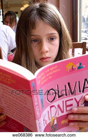 Girl child reading book View Large Photo Image Stock Photograph - Girl child reading book. Fotosearch