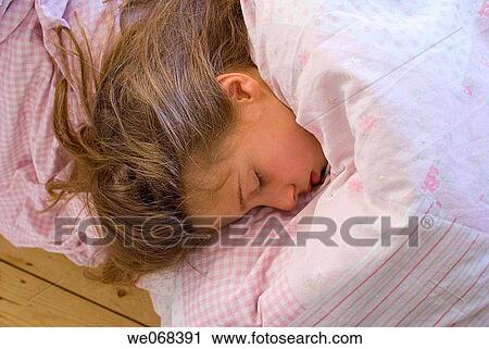 Girl child sleeping View Large Photo Image Stock Image - Girl child sleeping. Fotosearch