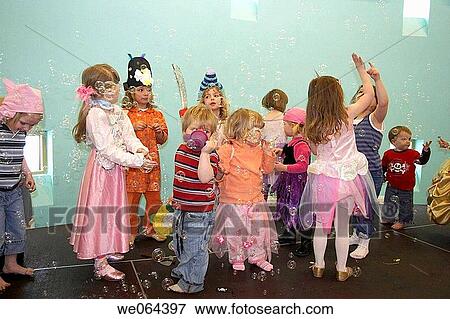 group of chidren playing with bubbles at a childrens pirate party View Large Photo Image Stock Photo - group of chidren playing with bubbles at a childrens pirate party. Fotosearch