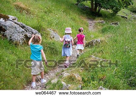 group of children on a walk in the counryside all following each other in a line View Large Photo Image Stock Photo - group of children on a walk in the counryside all following each other in a line. Fotosearch