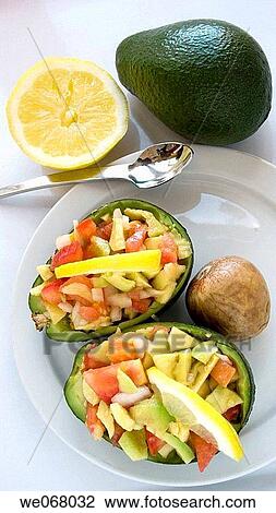 Stock Image - Guacamole, stuffed avocado. Fotosearch