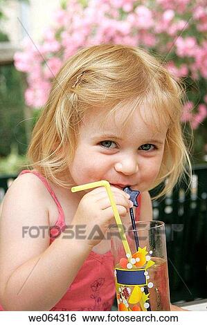 headshot of a 3 year old girl drinking through a straw View Large Photo Image Stock Photograph - headshot of a 3 year old girl drinking through a straw. Fotosearch