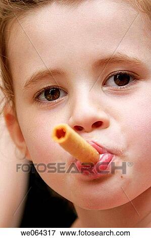 headshot of a 5 year old girl eating a biscuit View Large Photo Image Stock Photo - headshot of a 5 year old girl eating a biscuit. Fotosearch