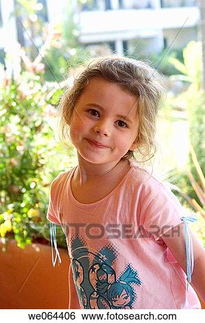 headshot of a 5 year old girl looking into camera smiling View Large Photo Image Stock Photograph - headshot of a 5 year old girl looking into camera smiling. Fotosearch