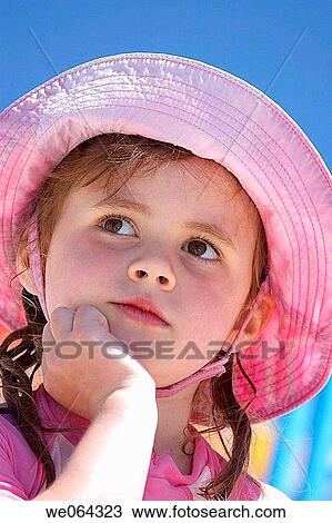 headshot of a 5 year old girl wearing a big sunhat at the pool sitting with her chin in her hand View Large Photo Image Stock Image - headshot of a 5 year old girl wearing a big sunhat at the pool sitting with her chin in her hand. Fotosearch