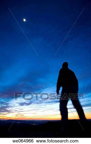 Hiker on the top of Maigm? mountains in the evening. Alicante province, Comunidad Valenciana, Spain View Large Photo Image Stock Photograph - Hiker on the top of Maigm? mountains in the evening. Alicante province, Comunidad Valenciana, Spain. Fotosearch