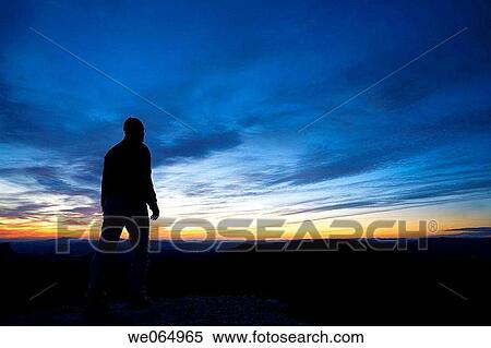 Hiker on the top of Maigm? mountains in the evening. Alicante province, Comunidad Valenciana, Spain View Large Photo Image Stock Photography - Hiker on the top of Maigm? mountains in the evening. Alicante province, Comunidad Valenciana, Spain. Fotosearch