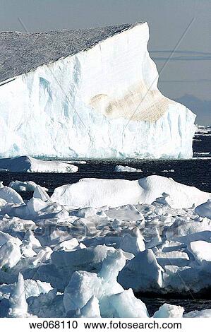 Stock Image - Icebergs in the Weddell Sea off the east coast of the Antarctic Peninsula. Ice is melting in this area of Antarctica at an alarming rate, probably due to Global Warming.. Fotosearch