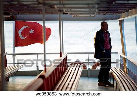 Man alone on a ferry boat waiting for departure. Bosphore, Istanbul, Turkey View Large Photo Image Stock Image - Man alone on a ferry boat waiting for departure. Bosphore, Istanbul, Turkey. Fotosearch