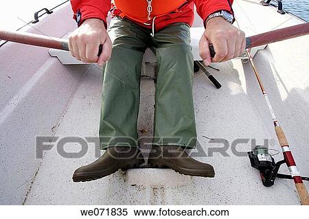 Man rowing a boat over Gaviksfj? rden, Norastr÷m, V? sternorrlands l? n, Sweden, Scandinavia, Europe View Large Photo Image Stock Photography - Man rowing a boat over Gaviksfj? rden, Norastr÷m, V? sternorrlands l? n, Sweden, Scandinavia, Europe. Fotosearch