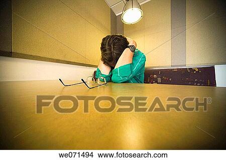 Man sitting at a cafeteria table View Large Photo Image Picture - Man sitting at a cafeteria table. Fotosearch