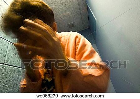 Man standing in a narrow hallway, covering his face View Large Photo Image Stock Photo - Man standing in a narrow hallway, covering his face. Fotosearch