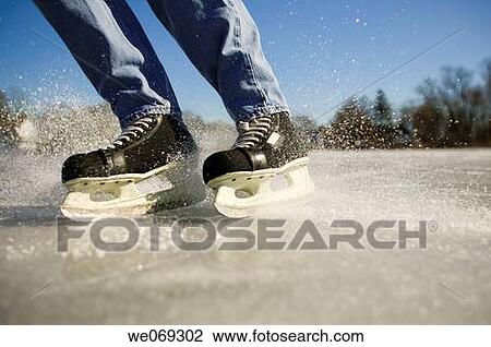 Man Stopping on Hockey Skates View Large Photo Image Stock Image - Man Stopping on Hockey Skates. Fotosearch