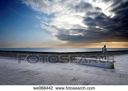 Man strolling by sea, Cadiz. Andalucia, Spain View Large Photo Image Stock Image - Man strolling by sea, Cadiz. Andalucia, Spain. Fotosearch