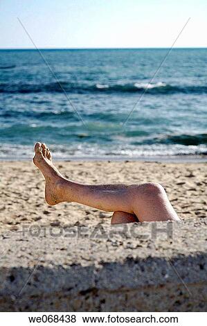 Man sunbathing on beach, La Caleta. Cadiz, Andalucia, Spain View Large Photo Image Stock Photo - Man sunbathing on beach, La Caleta. Cadiz, Andalucia, Spain. Fotosearch