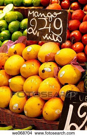 Picture - Mangoes for sale at La Boqueria market, Barcelona. Catalonia, Spain. Fotosearch
