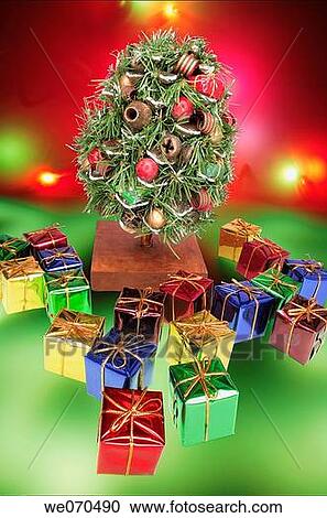 Stock Image - Miniature Christmas Tree and Gift Boxes. Fotosearch