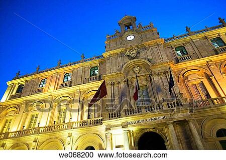 Stock Image - Palazzo dell? Universita (Palace of the University) lit at night. Catania. Sicily. Italy. Fotosearch