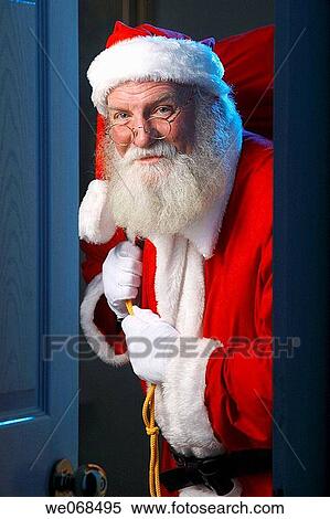Santa enters a house View Large Photo Image Stock Photography - Santa enters a house. Fotosearch