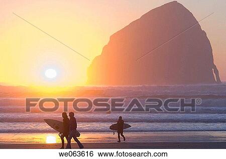 Silhouetted Surfers at Sunset - Pacific City, Oregon, USA View Large Photo Image Stock Photograph - Silhouetted Surfers at Sunset - Pacific City, Oregon, USA. Fotosearch