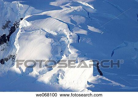 Snow capped mountains with snow cornices near the Antarctic Peninsula. View Large Photo Image Stock Image - Snow capped mountains with snow cornices near the Antarctic Peninsula.. Fotosearch