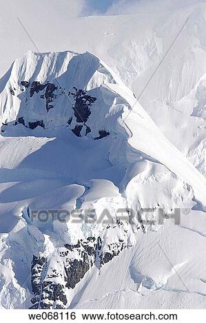 Snow-covered mountains in the Neumayer Channel of Antarctica. View Large Photo Image Stock Photograph - Snow-covered mountains in the Neumayer Channel of Antarctica.. Fotosearch