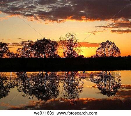 Sunset over the river View Large Photo Image Stock Photography - Sunset over the river. Fotosearch