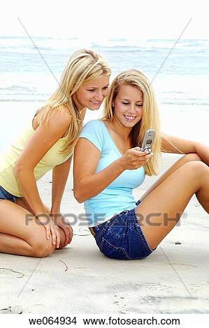 Teen age girls at the beach View Large Photo Image Picture - Teen age girls at the beach. Fotosearch