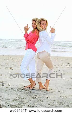 Teen age girls at the beach View Large Photo Image Stock Photo - Teen age girls at the beach. Fotosearch