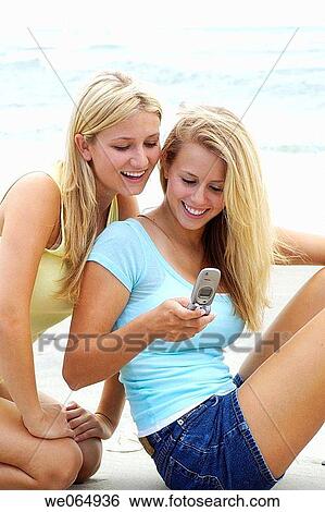 Teen age girls at the beach View Large Photo Image Stock Photograph - Teen age girls at the beach. Fotosearch