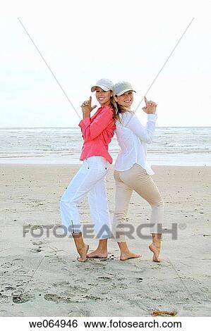 Stock Photograph - Teen age girls at the beach. Fotosearch