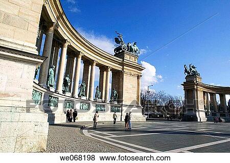 Tourists looking at statues in Heroes Square (Hosok Ter). Budapest. Hungary View Large Photo Image Stock Photo - Tourists looking at statues in Heroes Square (Hosok Ter). Budapest. Hungary. Fotosearch