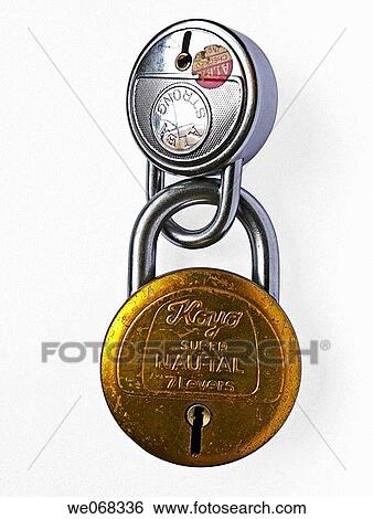 Two locks made of steel and brass are interlocked with each other. Pune, Maharashtra, India. View Large Photo Image Stock Photograph - Two locks made of steel and brass are interlocked with each other. Pune, Maharashtra, India.. Fotosearch