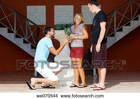 Two men competing for a woman View Large Photo Image Picture - Two men competing for a woman. Fotosearch
